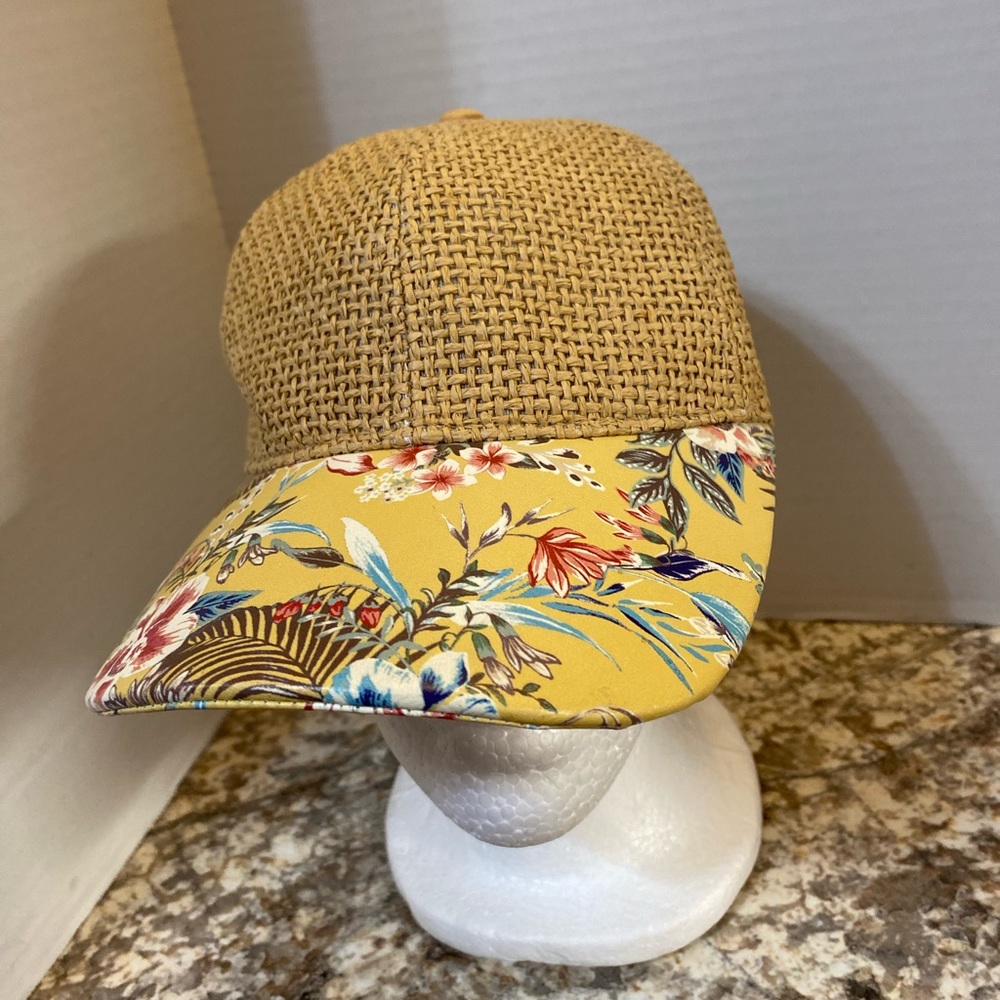 Baseball style hat.  Flowered bill and woven like material on cap.